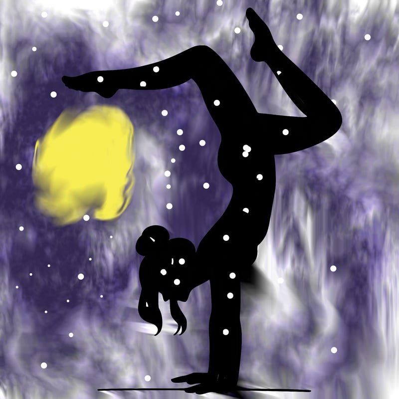 a woman doing a handstand