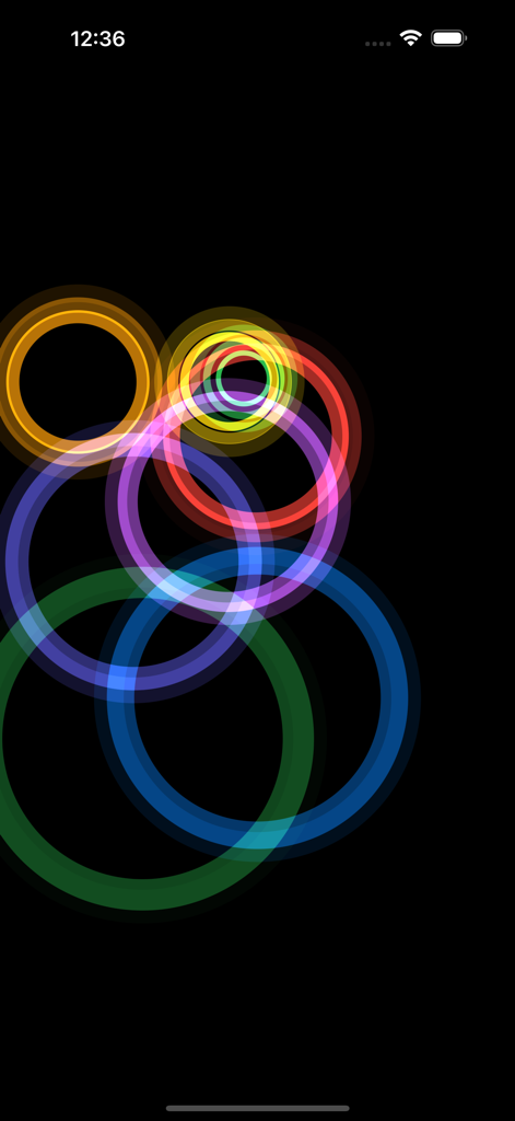 Rainbow Ripples - Multiple colorful rainbow circles overlapping on a black screen