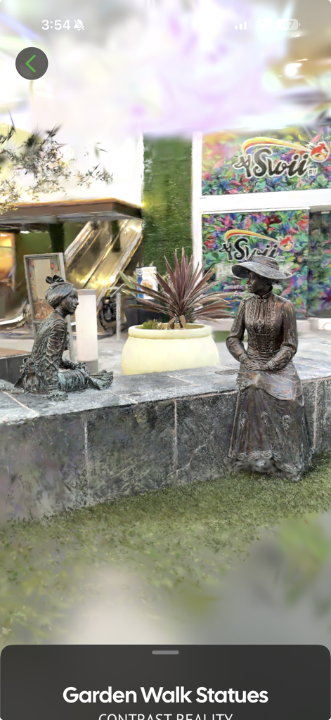3D Gaussian Splatting render of bronze statues in the spatial fields app