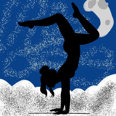 a woman doing a handstand
