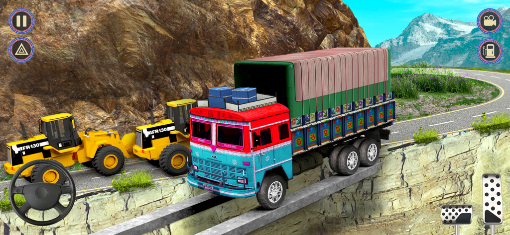 A colorful Indian truck crossing a narrow concrete bridge on a mountain cliff side