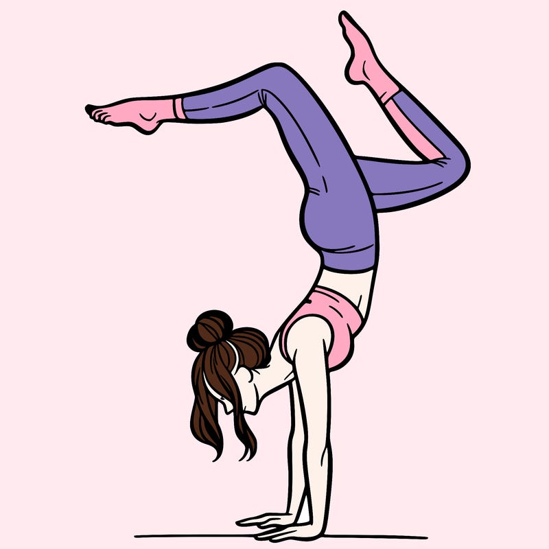 a woman doing a handstand