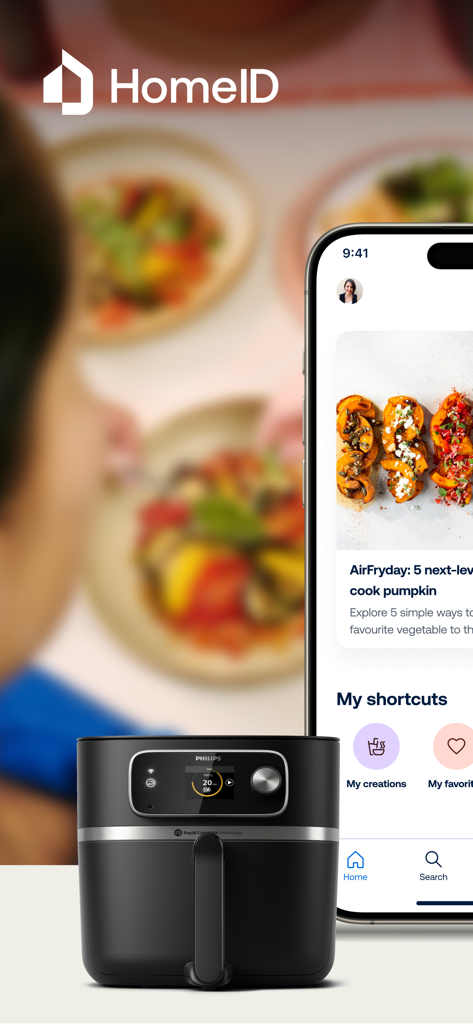 HomeID (Kitchen+) - Interfaccia dell'app mobile HomeID che mostra ricette di zucca accanto a una friggitrice ad aria Philips nera