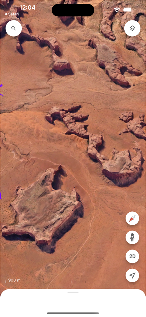 High-resolution 3D satellite view of a desert canyon landscape within the Google Earth app.