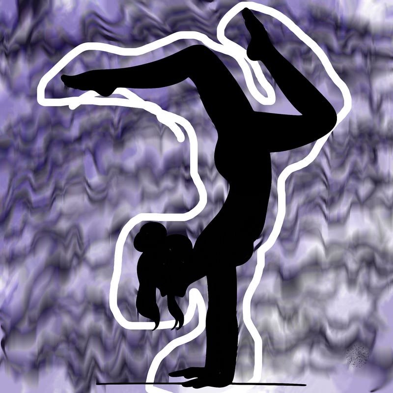 a woman doing a handstand