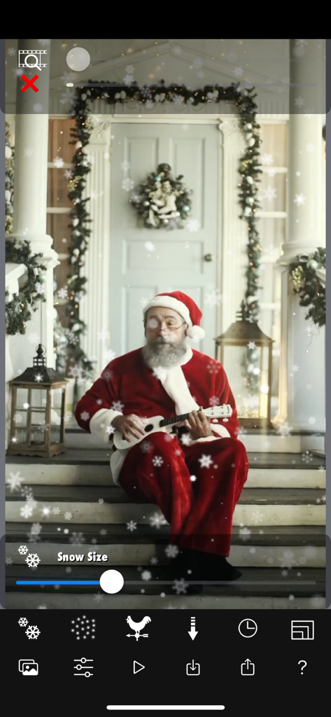 Snow Effect Video - モバイルビデオエディターアプリで降雪効果のあるウクレレを弾くサンタクロース