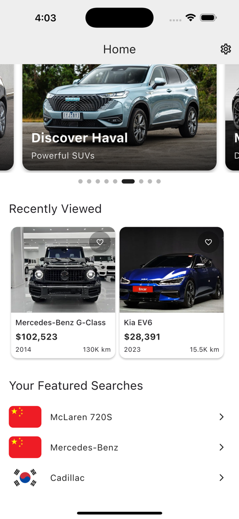 高級車リストと国際検索カテゴリが表示されているグローバルカーサーチアプリのホーム画面。