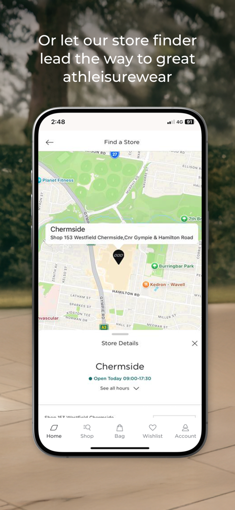 A smartphone displaying the Lorna Jane app store finder feature with a map and location details for activewear
