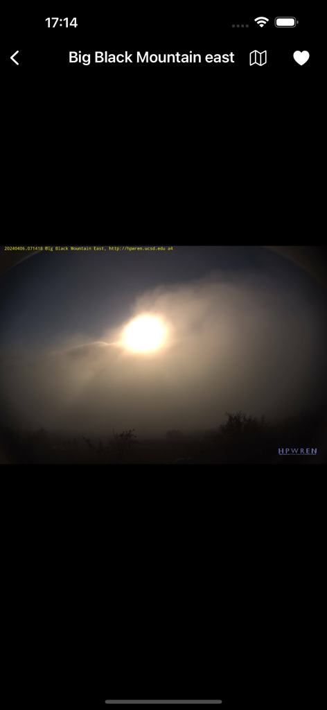 California Fire Cams - Real-time camera feed from Big Black Mountain east showing sun through smoke or fog in California