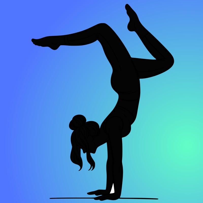 a woman doing a handstand