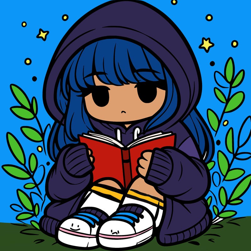 girl in oversized hoodie reading a book