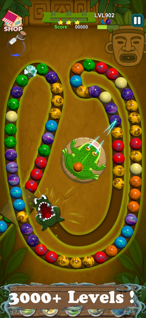 Classic marble shooter game showing a frog shooting colored balls on a winding path in a jungle setting