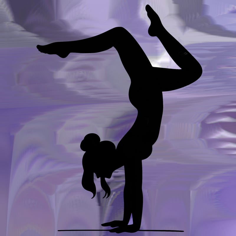 a woman doing a handstand