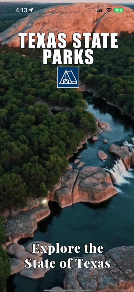 TX State Parks - TX State Parks app splash screen featuring a scenic view of a river flowing through a lush forest and rocky terrain