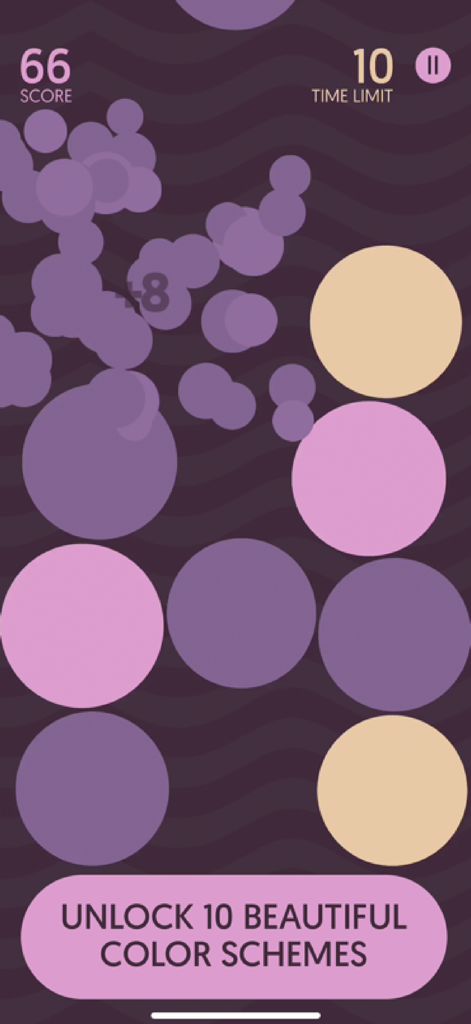 Dream Bubblez gameplay screen showing colorful bubbles and a message about unlocking ten color schemes.