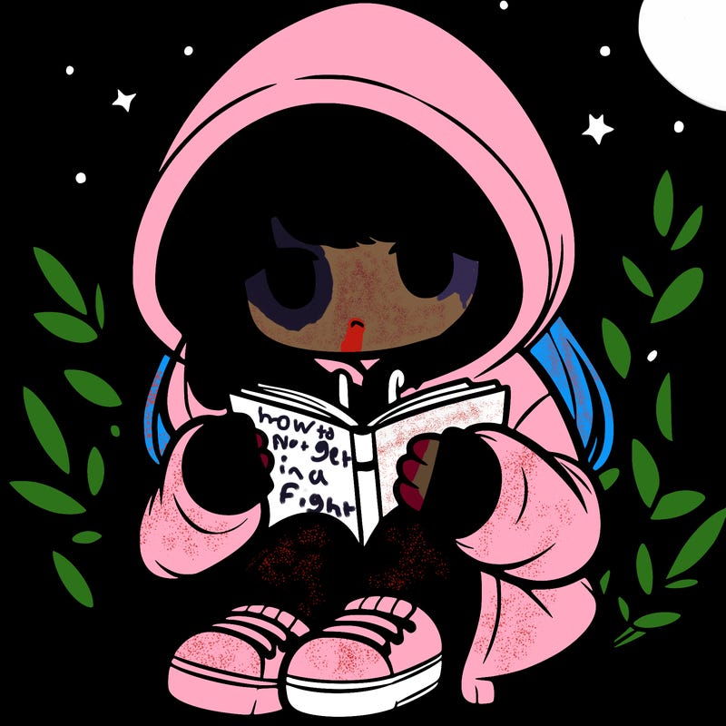 girl in oversized hoodie reading a book
