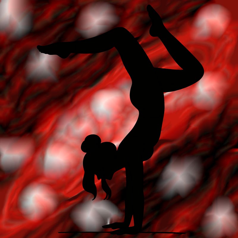 a woman doing a handstand