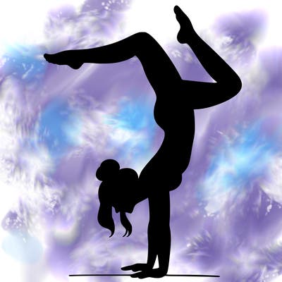 a woman doing a handstand