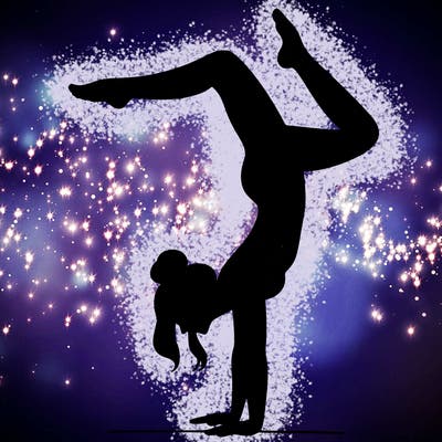 a woman doing a handstand