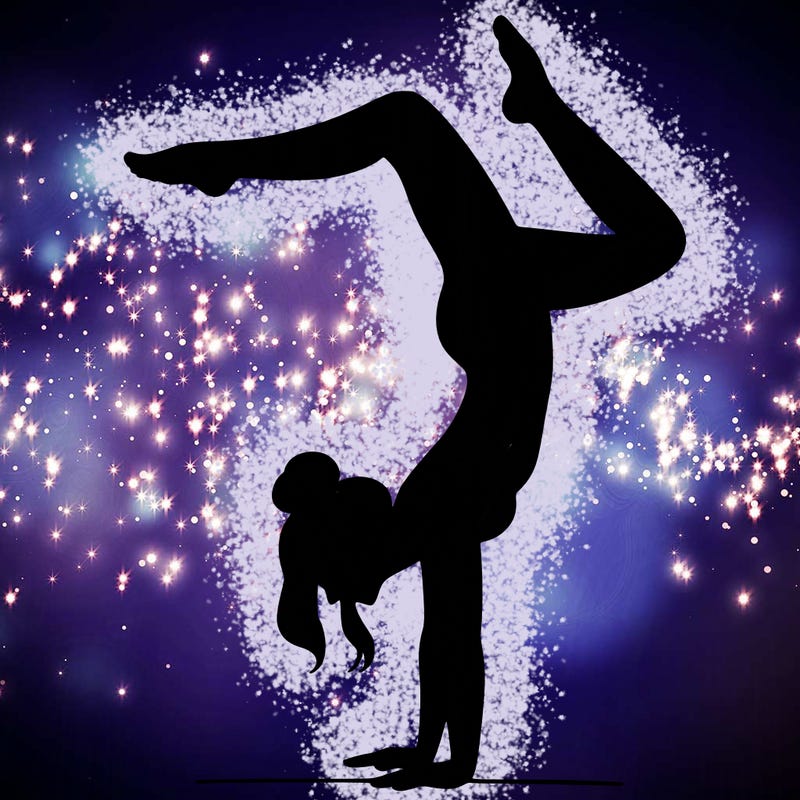 a woman doing a handstand