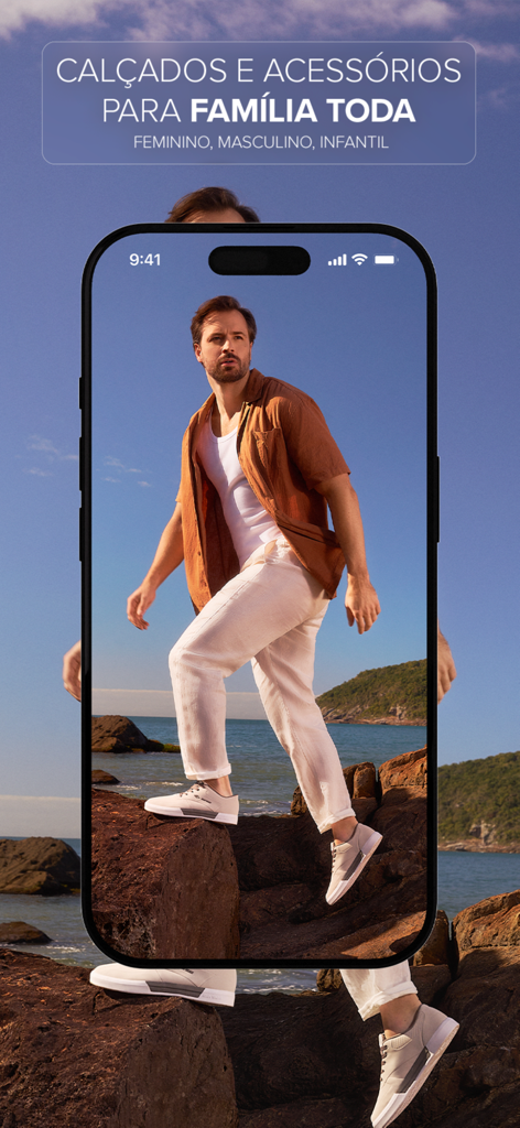 Studio Z Calçados e Acessórios - Studio Z mobile app screen showing footwear for the whole family with a man walking on coastal rocks