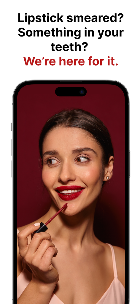 True Mirror: Ring Light  Zoom - A woman using the True Mirror app on an iPhone to check her lipstick