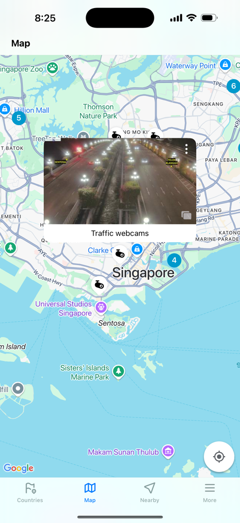 Map view of the Traffic Cameras Live app showing a real-time webcam feed of a highway in Singapore.