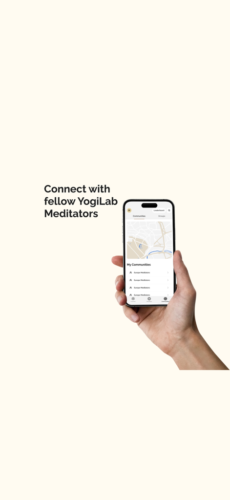A hand holding an iPhone showing the YogiLab Vipassana app community screen featuring a map and local meditation groups.