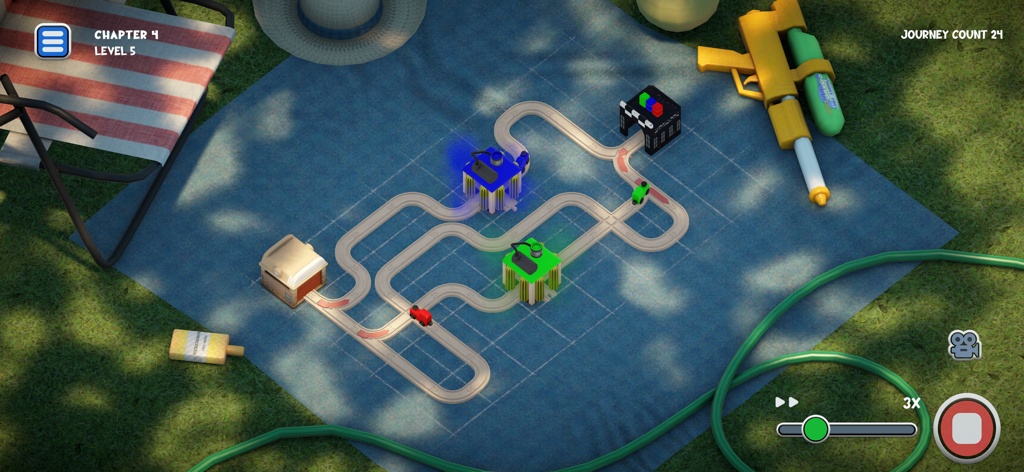 Teeny Tiny Trains - Un set di puzzle con binari per treni in legno in miniatura su una coperta blu in una scena di giardino