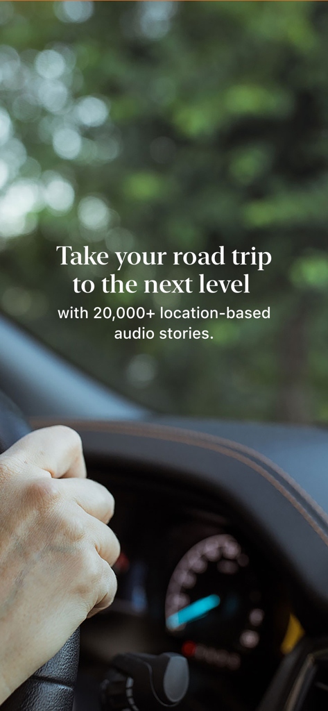 A person driving a car with text describing location-based audio stories for road trips