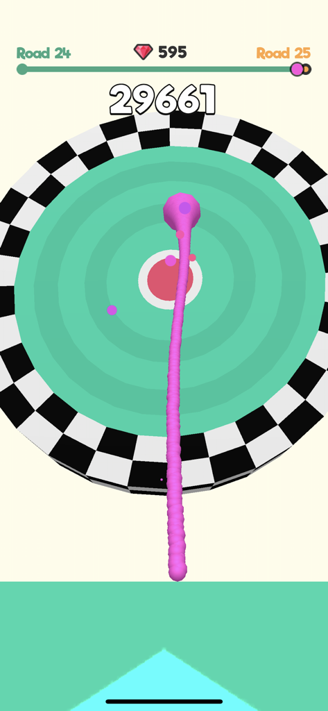 A pink slime ball jumping through a green ring towards a bullseye target in the Slime Road mobile game
