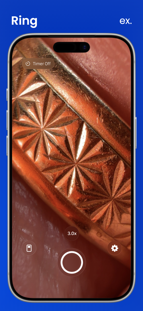 A screenshot of the Macroscope Cam app interface showing a 3x zoom close-up of a gold ring with intricate star patterns.