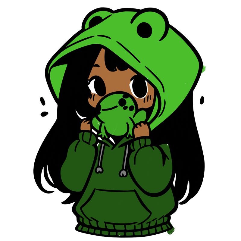 a girl holding a froggy hoodie