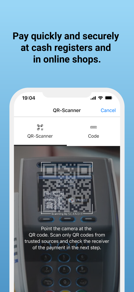 A smartphone using the TWINT app to scan a QR code on a payment terminal for a secure transaction.