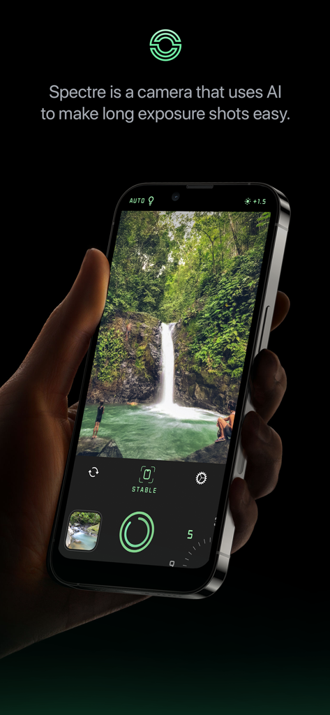 Spectre Camera - Hand holding an iPhone with Spectre Camera app capturing a long exposure photo of a waterfall