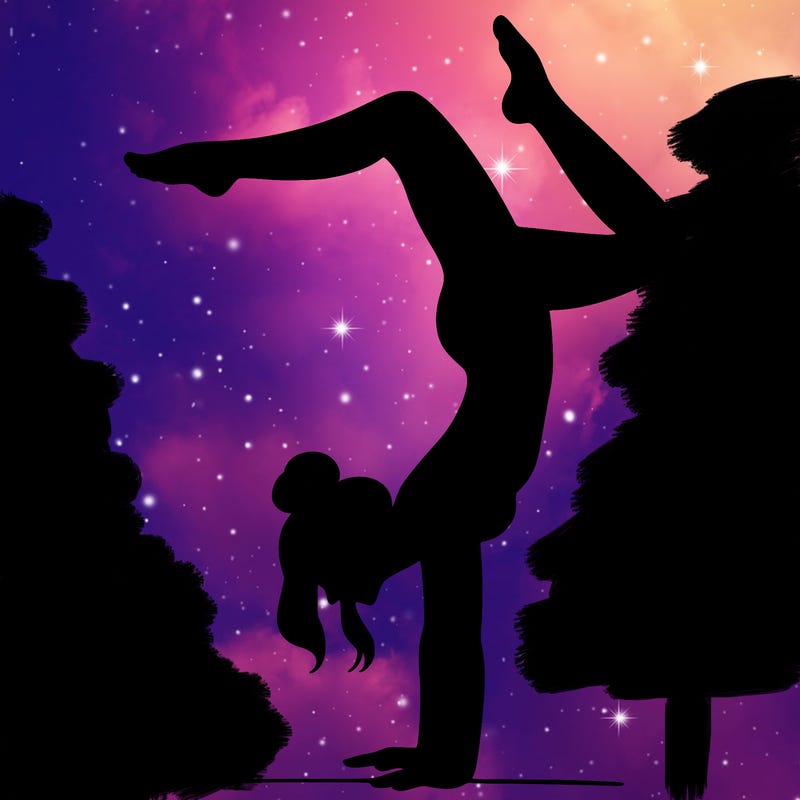 a woman doing a handstand