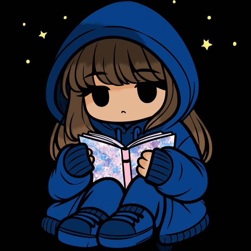 girl in oversized hoodie reading a book