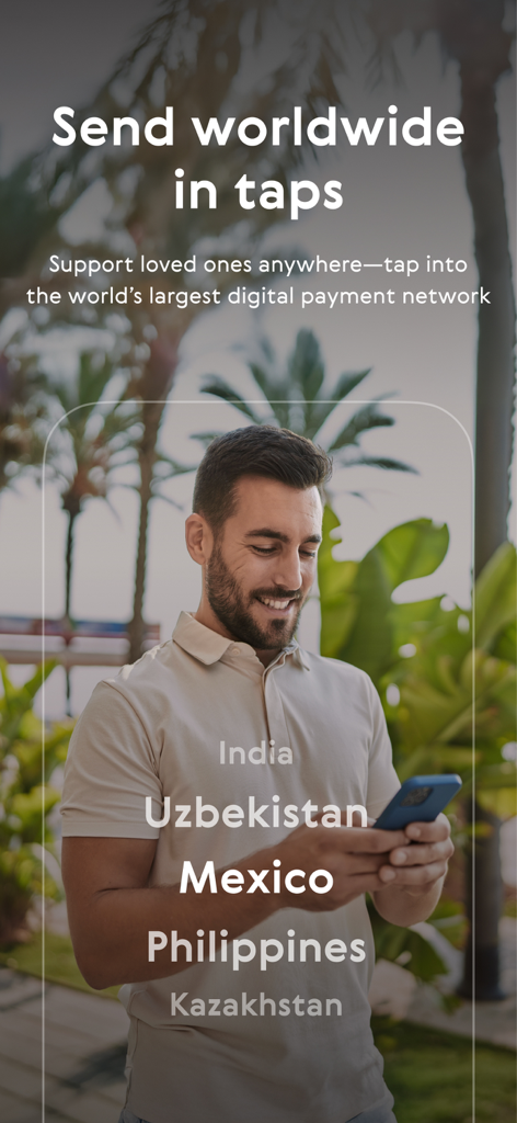 A man smiling while using the Paysend app to send money internationally to countries like India and Mexico.