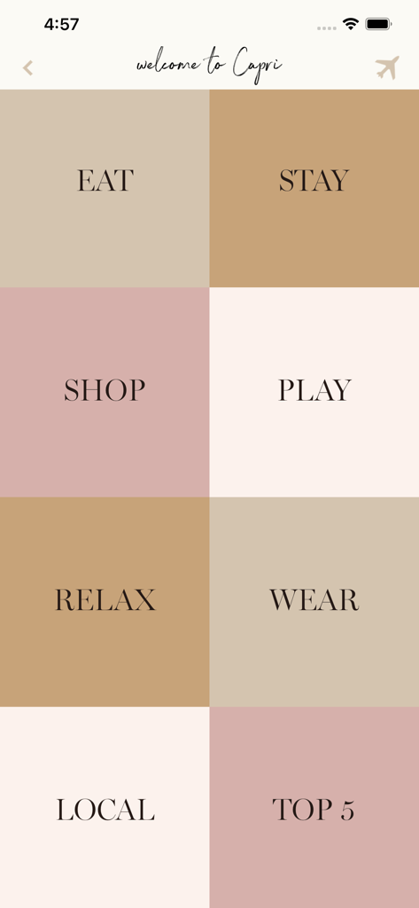 With Love From Kat Travel - カプリの街ガイド画面。Eat、Stay、Wearなどの旅行カテゴリーが表示されているWith Love From Katアプリ。