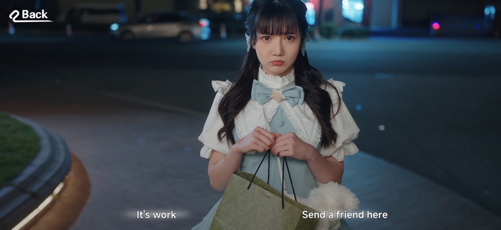 A young woman in a blue dress holding a shopping bag in a scene from the Fallen For You dating simulation game.