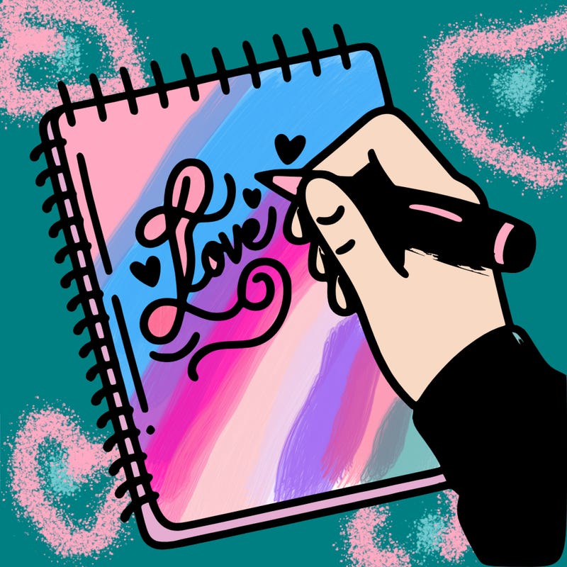 a hand writing “love” in calligraphy on a notebook