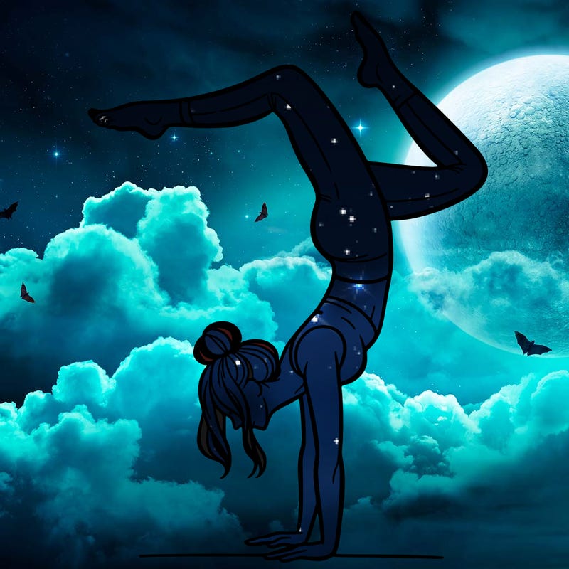 a woman doing a handstand