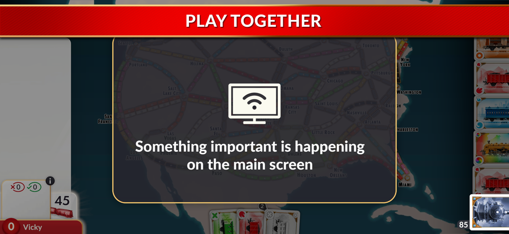 Ticket to Ride Companion app interface showing a notification to watch the main screen during local multiplayer play