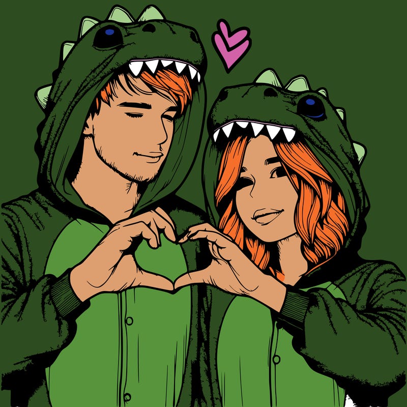 realistic couple wearing matching dinosaur onesies with heart hand gesture