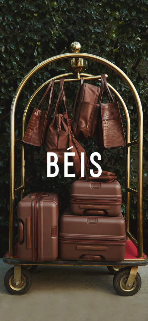 BÉIS - A gold luggage cart filled with BÉIS brown travel bags and suitcases
