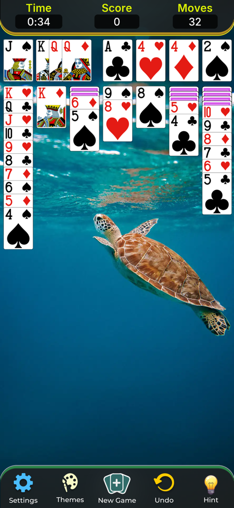 Solitaire Classic Game. - A screenshot of a Klondike solitaire game in progress featuring a sea turtle swimming in the ocean as a background theme.