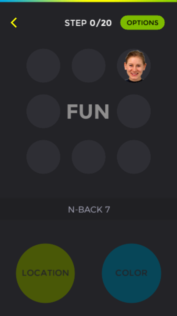 Interface of the Dual N Back Pro app showing an emotional cognitive training task with location and color buttons