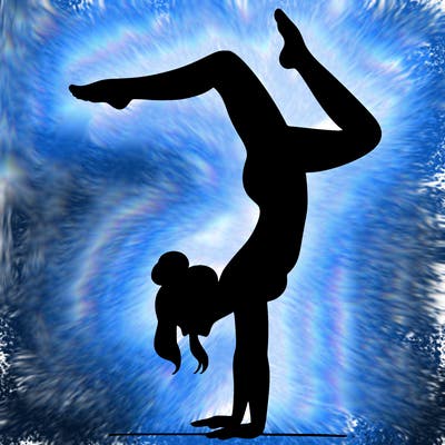 a woman doing a handstand