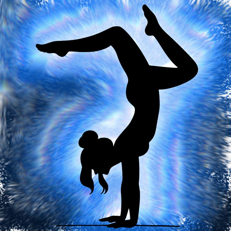 a woman doing a handstand