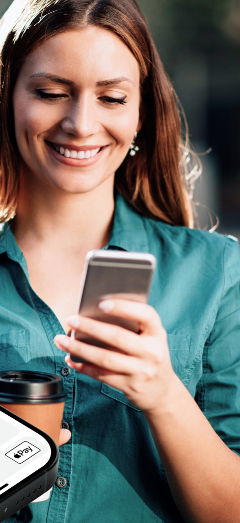 Smiling woman using her smartphone for banking with Apple Pay integration